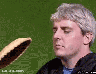 Man Looking At Pancake Thrown At Him GIF