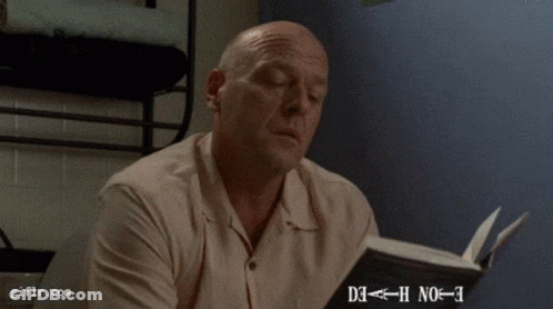 Man Looking At Paper With Giflr Watermark GIF