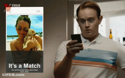 Man Looking At Phone Next To Tinder Profile GIF