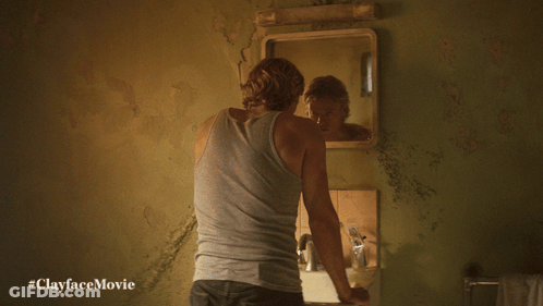 Man Looking At Reflection In Mirror #Clayfacemovie GIF