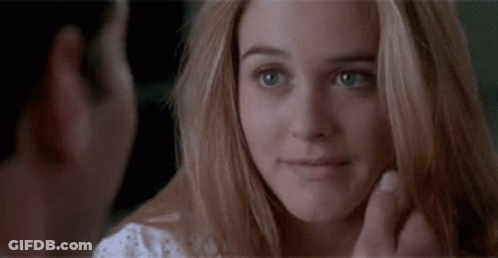 Man Looking At Woman's Face Close Up GIF