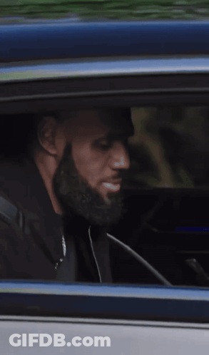 Man Looking Out Car Window While Driving GIF