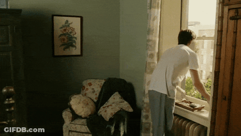 Man Looking Out Window GIF