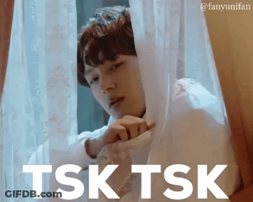 Man Looking Out Window Saying Tsk Tsk GIF
