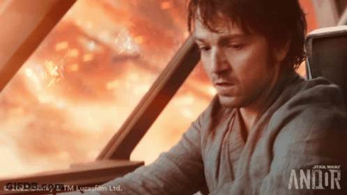 Man Looking Out Window With Andor GIF