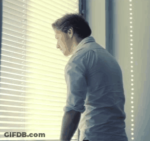 Man Looking Out Window With Blinds GIF