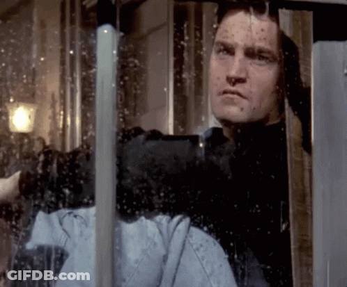 Man Looking Out Window With Reflection GIF
