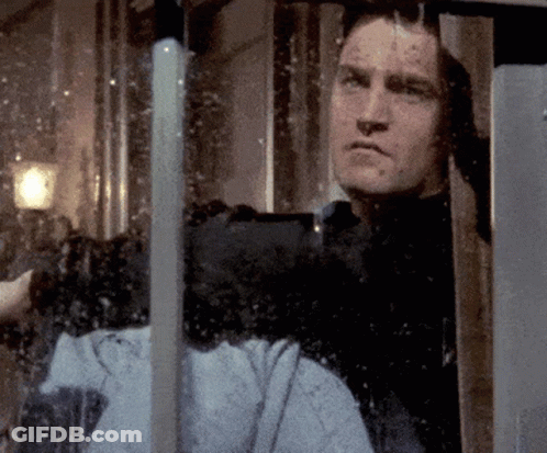 Man Looking Out Window With Reflection Of Person GIF