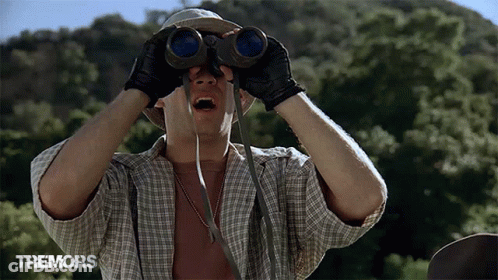 Man Looking Through Binoculars Tremors GIF