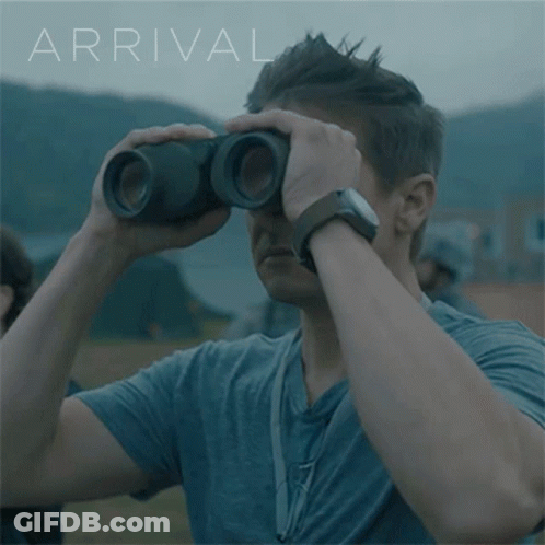 Man Looking Through Binoculars With Arrival GIF