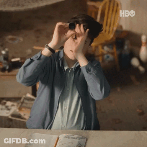 Man Looking Through Binoculars With HBO Logo GIF