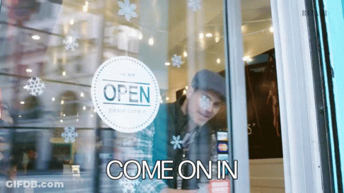 Man Looking Through Glass Door With Open Sign GIF
