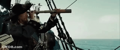 Man Looking Through Telescope On Ship Deck GIF