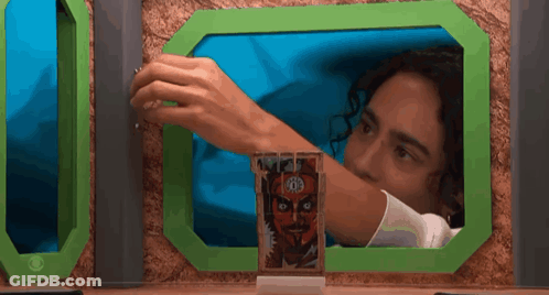 Man Looking Through Window At Tarot Card GIF
