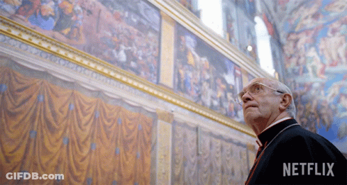 Man Looking Up At Painting With Netflix Logo GIF