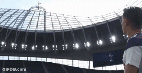 Man Looking Up At Soccer Stadium Roof GIF