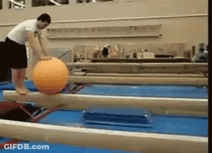 Man Loses Balance On Big Ball GIF