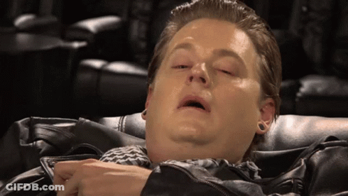 Man Lying Down With Eyes Closed And Jacket GIF