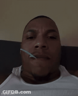 Man Lying Down With Spoon In Mouth GIF