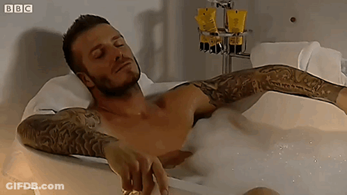 Man Lying In Bathtub With BBC GIF
