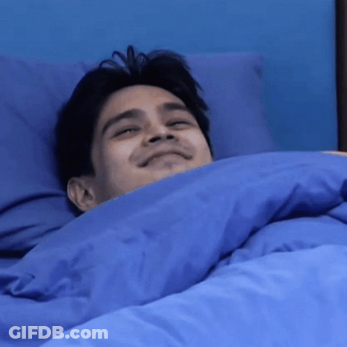Man Lying In Bed With Blue Comforter GIF