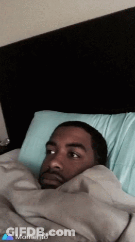 Man Lying In Bed With Blue Pillow GIF