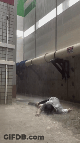 Man Lying In Flood, Danger Do Not Enter GIF