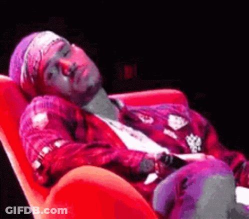 Man Lying In Red Chair GIF
