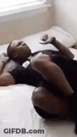 Man Lying On Bed Crossed Legs GIF