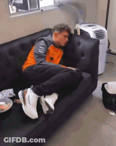 Man Lying On Couch Next To Air Conditioner GIF