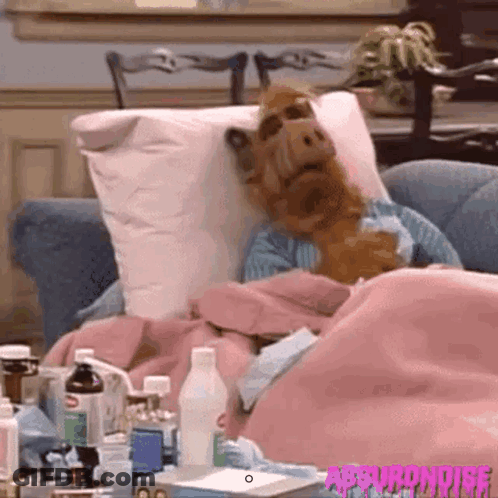 Man Lying On Couch With Ice Pack GIF