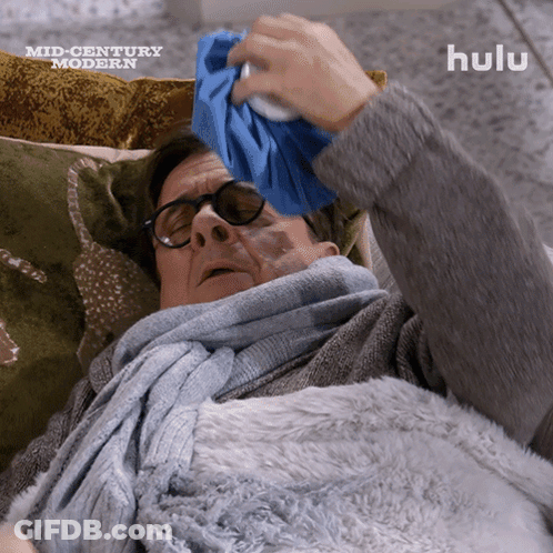 Man Lying On Couch With Ice Pack GIF