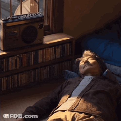 Man Lying On Floor In Front Of Domingo Radio GIF