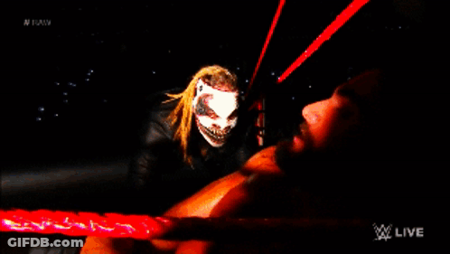Man Lying On Ground Behind Monster GIF
