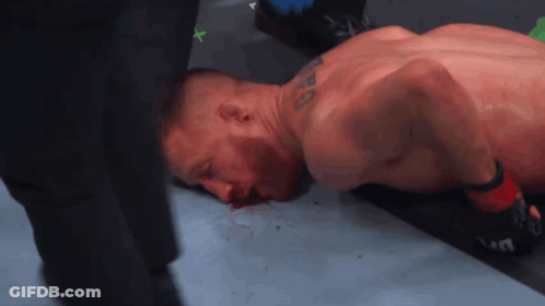 Man Lying On Ground Bleeding From Mouth GIF
