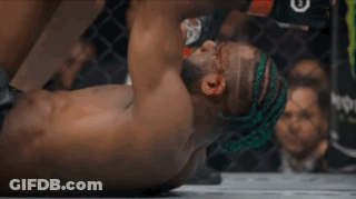 Man Lying On Ground With Letter E On Head GIF