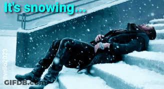 Man Lying On Snowy Stairs Saying Its Snowing GIF