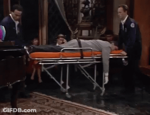 Man Lying On Stretcher In Living Room GIF