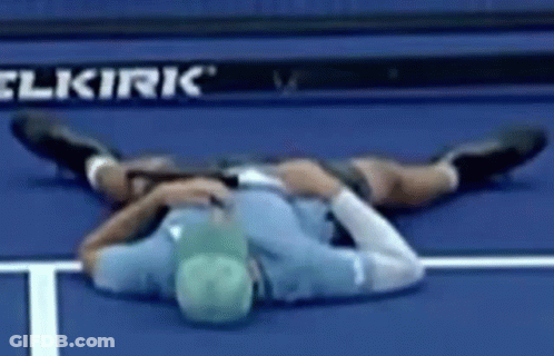 Man Lying On Tennis Court GIF