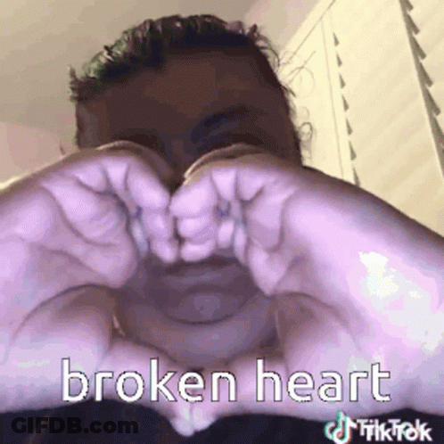 Man Making Broken Heart With Hands GIF