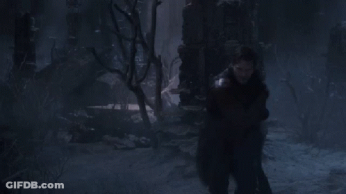 Man Making Face In Front Of Jurassic World Sign GIF