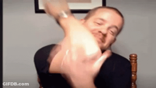 Man Making Funny Face And Raising Hand GIF