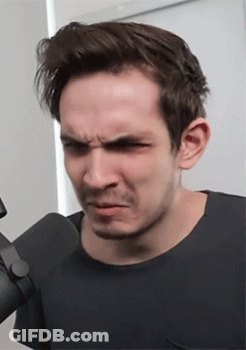 Man Making Funny Face At Microphone GIF