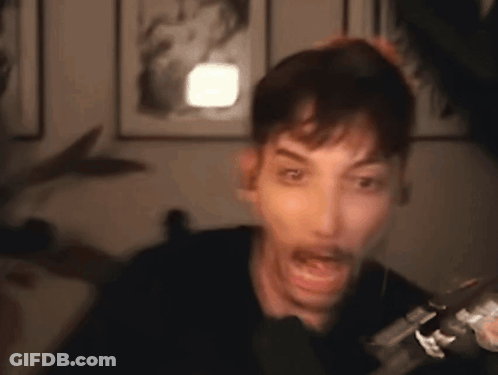 Man Making Funny Face At Microphone GIF