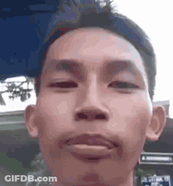 Man Making Funny Face Eyes Closed GIF