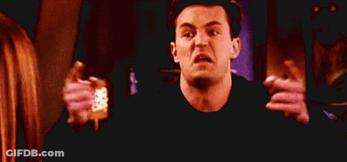 Man Making Funny Face Holding Pink Socks GIF
