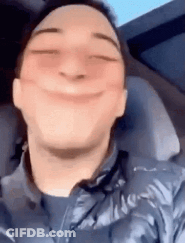 Man Making Funny Face In Car GIF