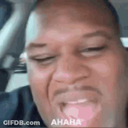 Man Making Funny Face In Car With Eyes Closed GIF