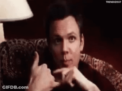 Man Making Funny Face In Chair GIF