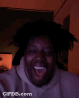 Man Making Funny Face In Dark Room GIF